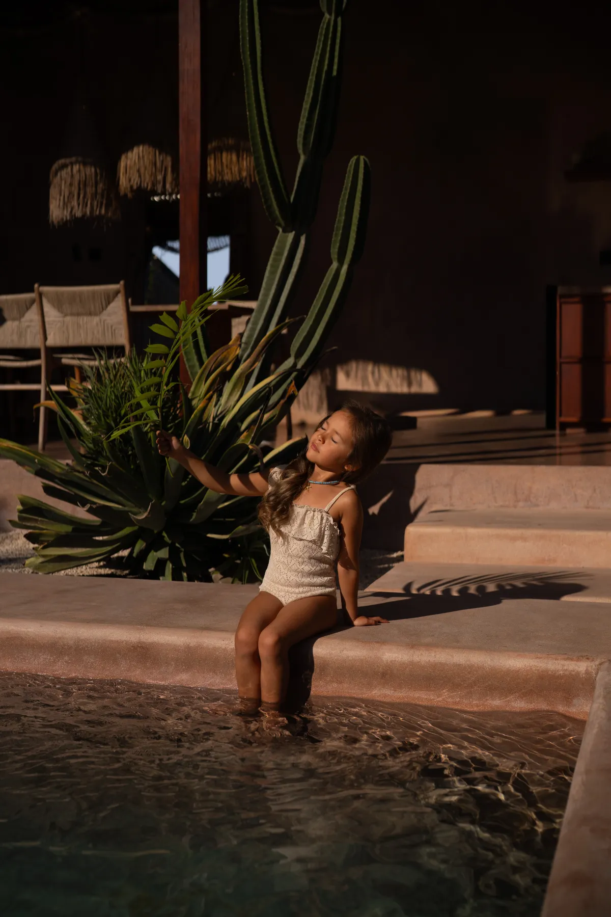 Girl at pool steps, golden hour: byduran