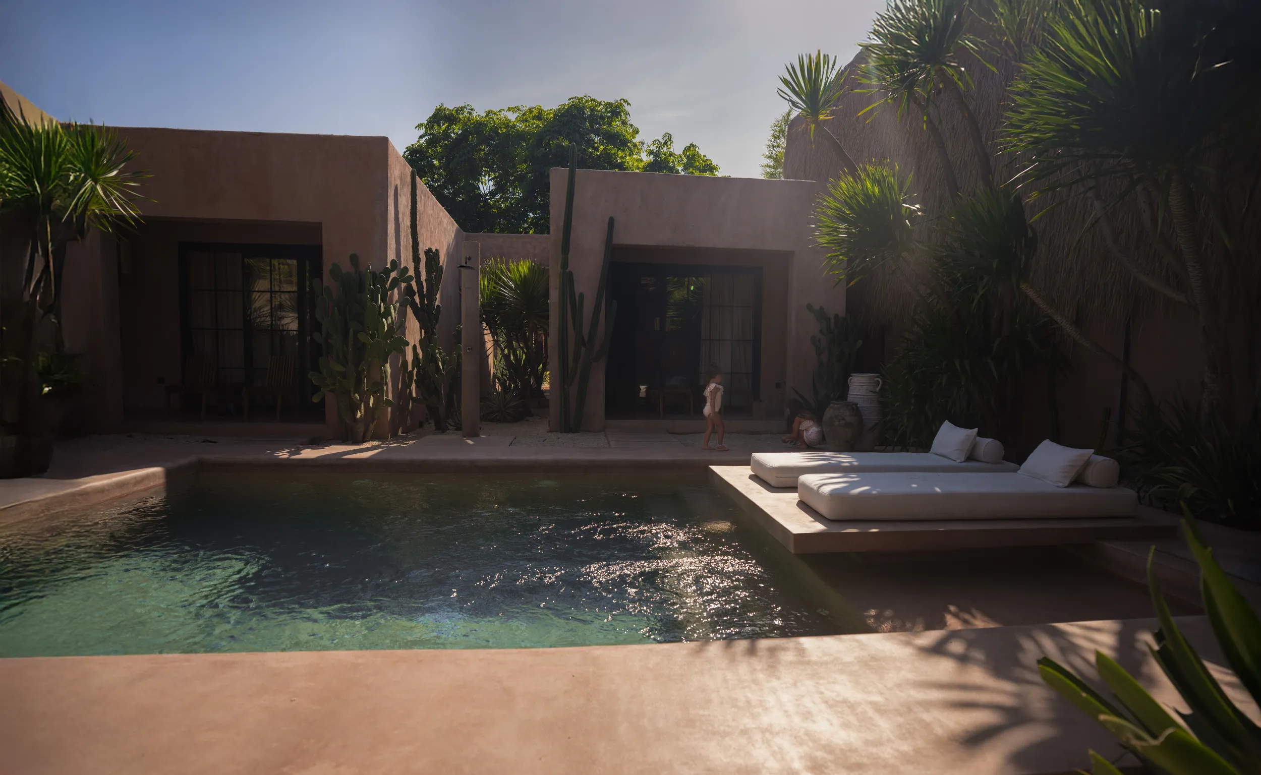 Spaces and architecture: villa courtyard pool at golden hour