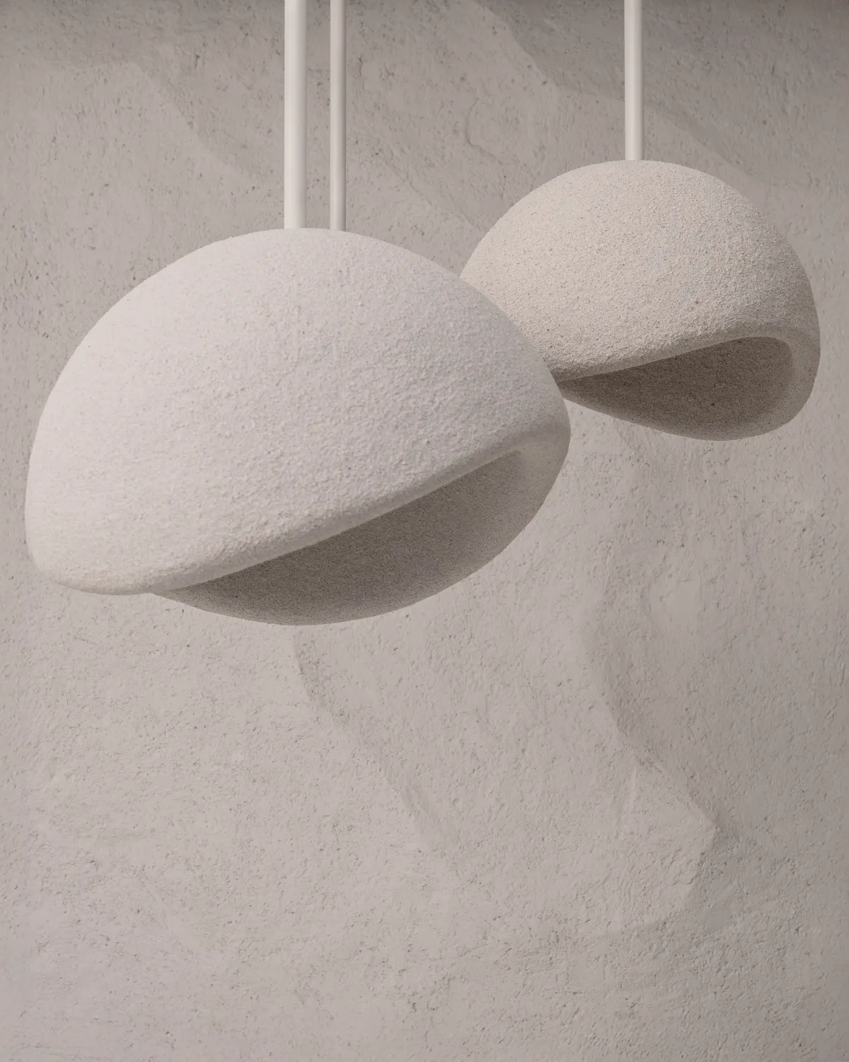 Spaces and architecture: sculptural pendant lights against a textured wall
