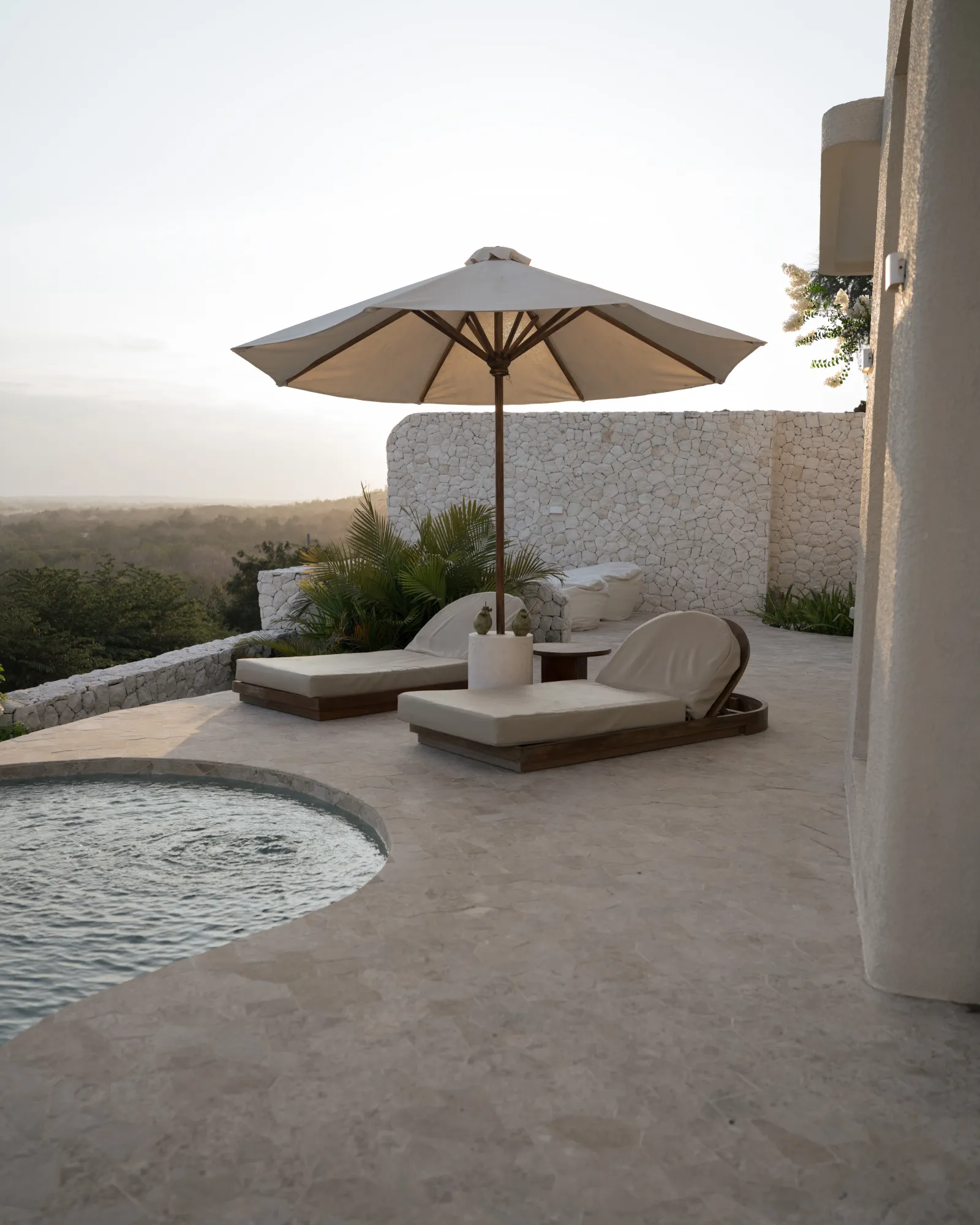 Spaces & Architecture photography: empty poolside loungers overlooking the valley