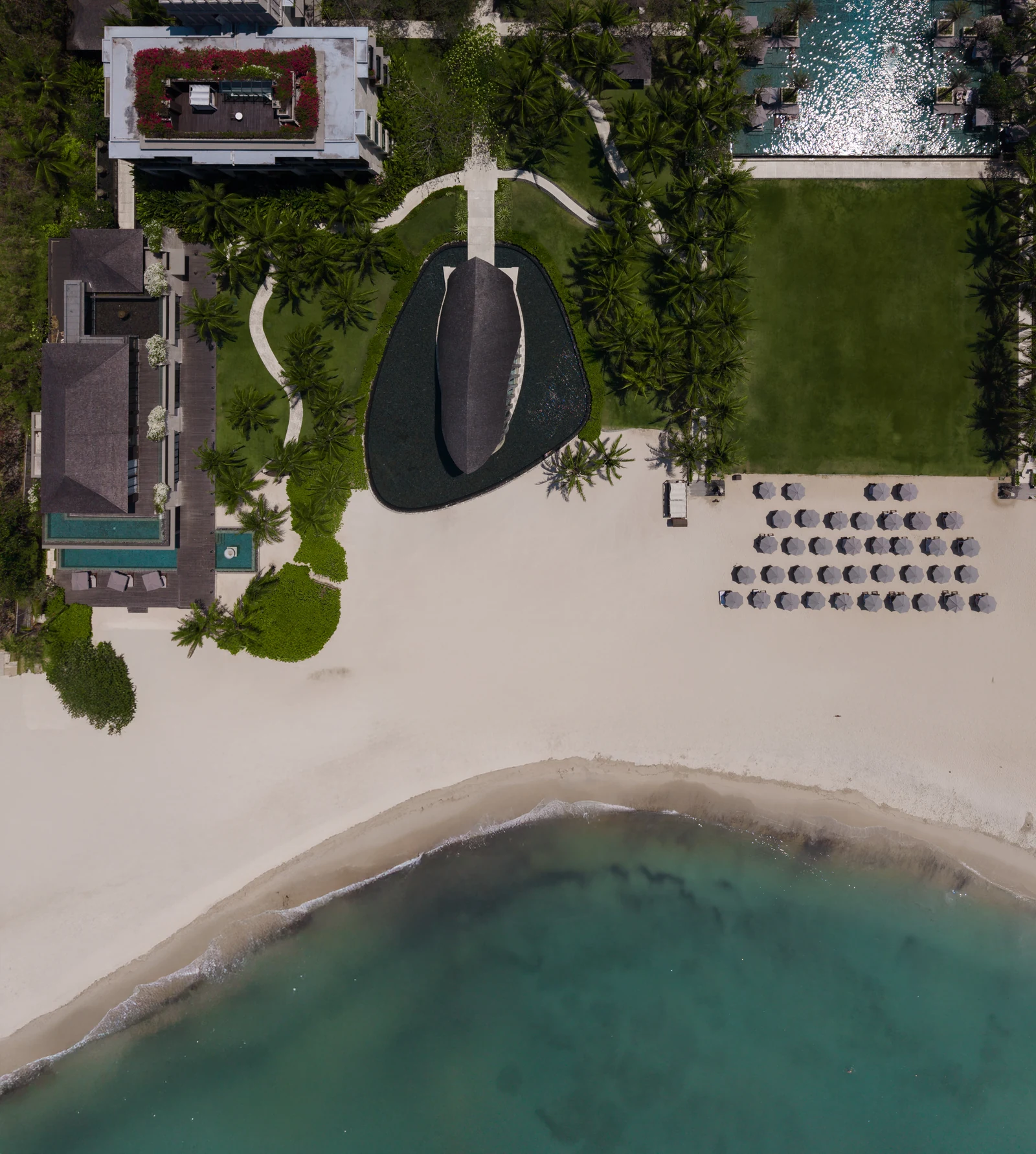 Spaces and architecture: aerial view of a sculptural beach pavilion